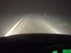 Car driving in the fog